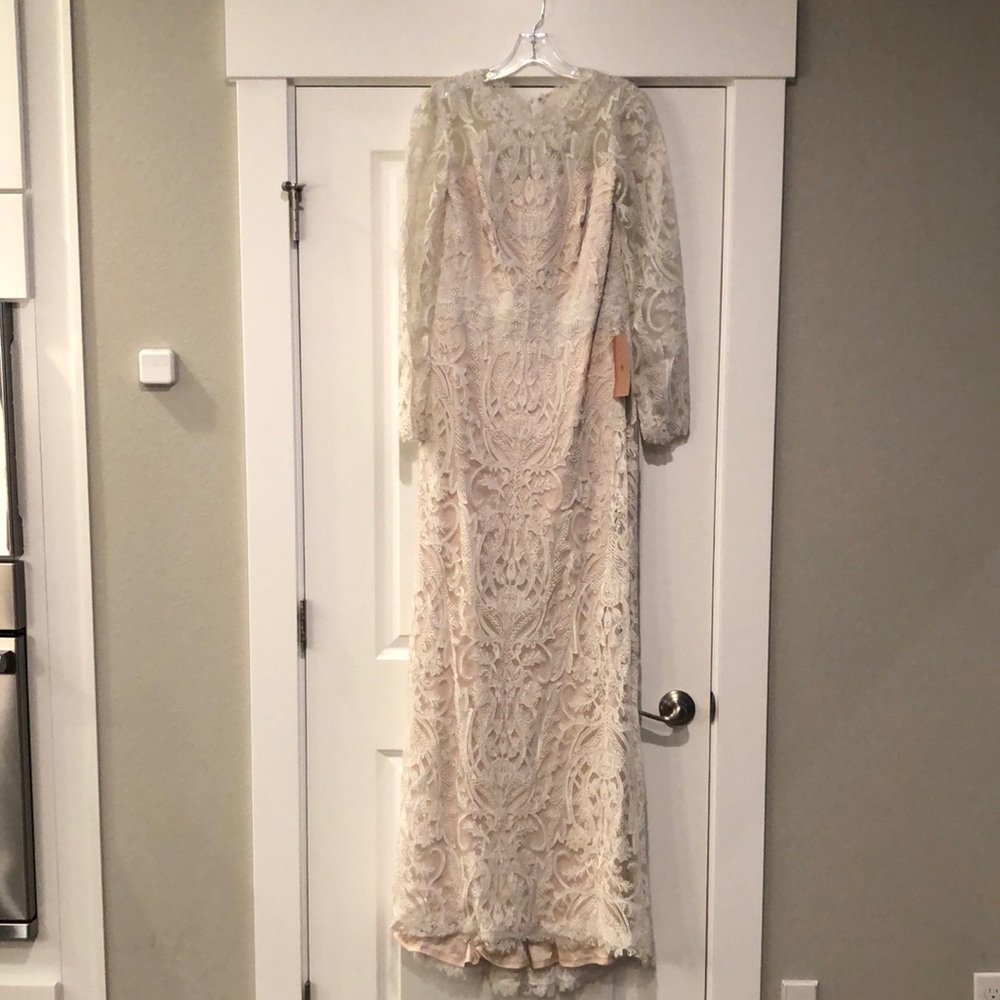 Beautiful Tadashi Shoji cream lace wedding dress with blush underlay.